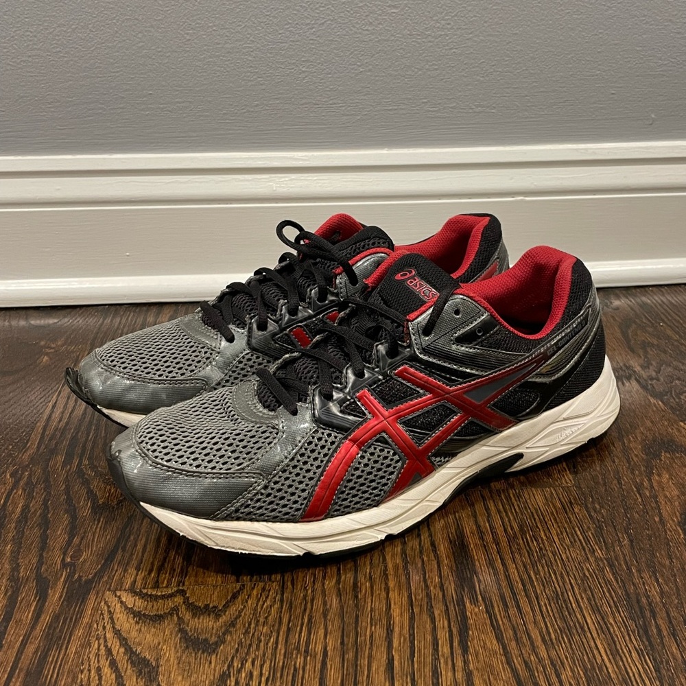 ASICS red and grey running shoe.